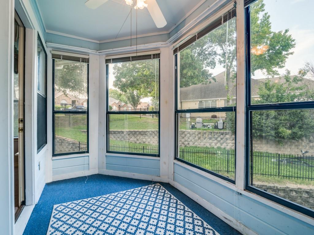 9981 Waterfront Trail Rowlett, TX 75087 - Photo 18 of 26 a view of a room with wooden floor and doors