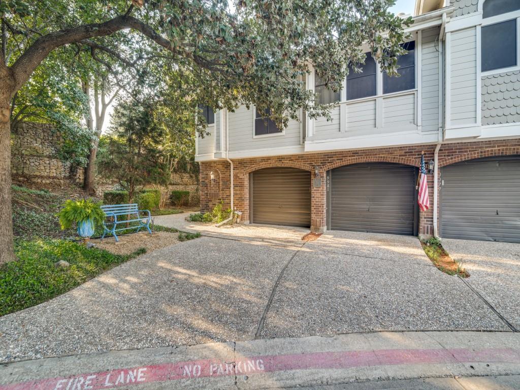 9981 Waterfront Trail Rowlett, TX 75087 - Photo 3 of 26 a front view of a house with a yard and garage