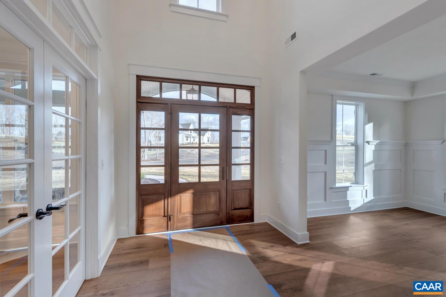 2 Jarmans Gap Road, Unit LOT 2 JARMANS GAP Crozet, VA 22932 - Photo 2 of 48 a view of a big room with wooden floor and windows