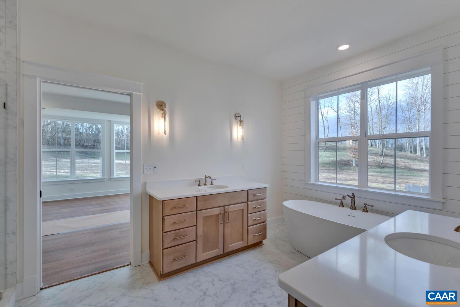 2 Jarmans Gap Road, Unit LOT 2 JARMANS GAP Crozet, VA 22932 - Photo 23 of 48 a spacious bathroom with double vanity and a mirror