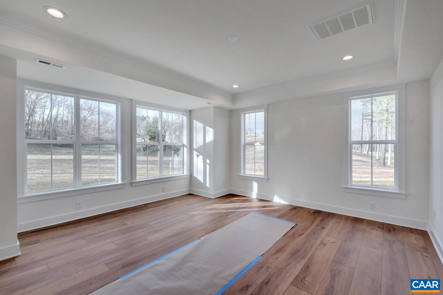 2 Jarmans Gap Road, Unit LOT 2 JARMANS GAP Crozet, VA 22932 - Photo 27 of 48 a view of an empty room with wooden floor and a window