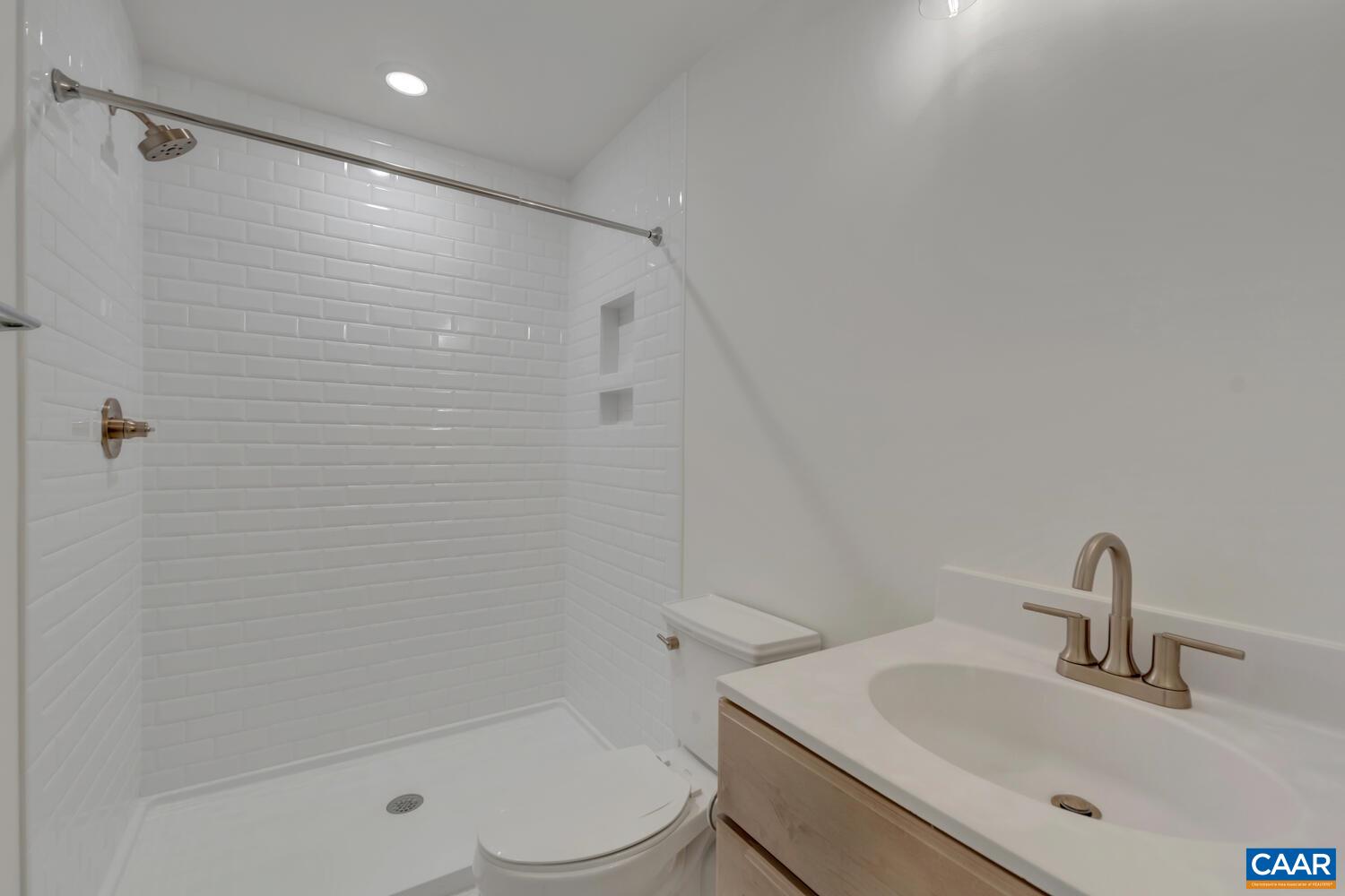 2 Jarmans Gap Road, Unit LOT 2 JARMANS GAP Crozet, VA 22932 - Photo 38 of 48 a bathroom with a sink a toilet and shower