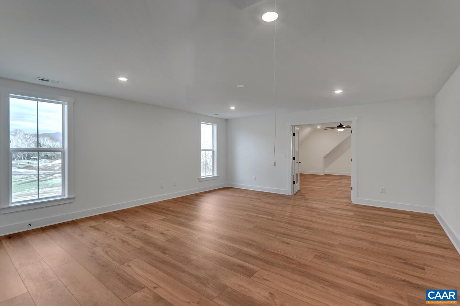 2 Jarmans Gap Road, Unit LOT 2 JARMANS GAP Crozet, VA 22932 - Photo 43 of 48 an empty room with wooden floor and windows
