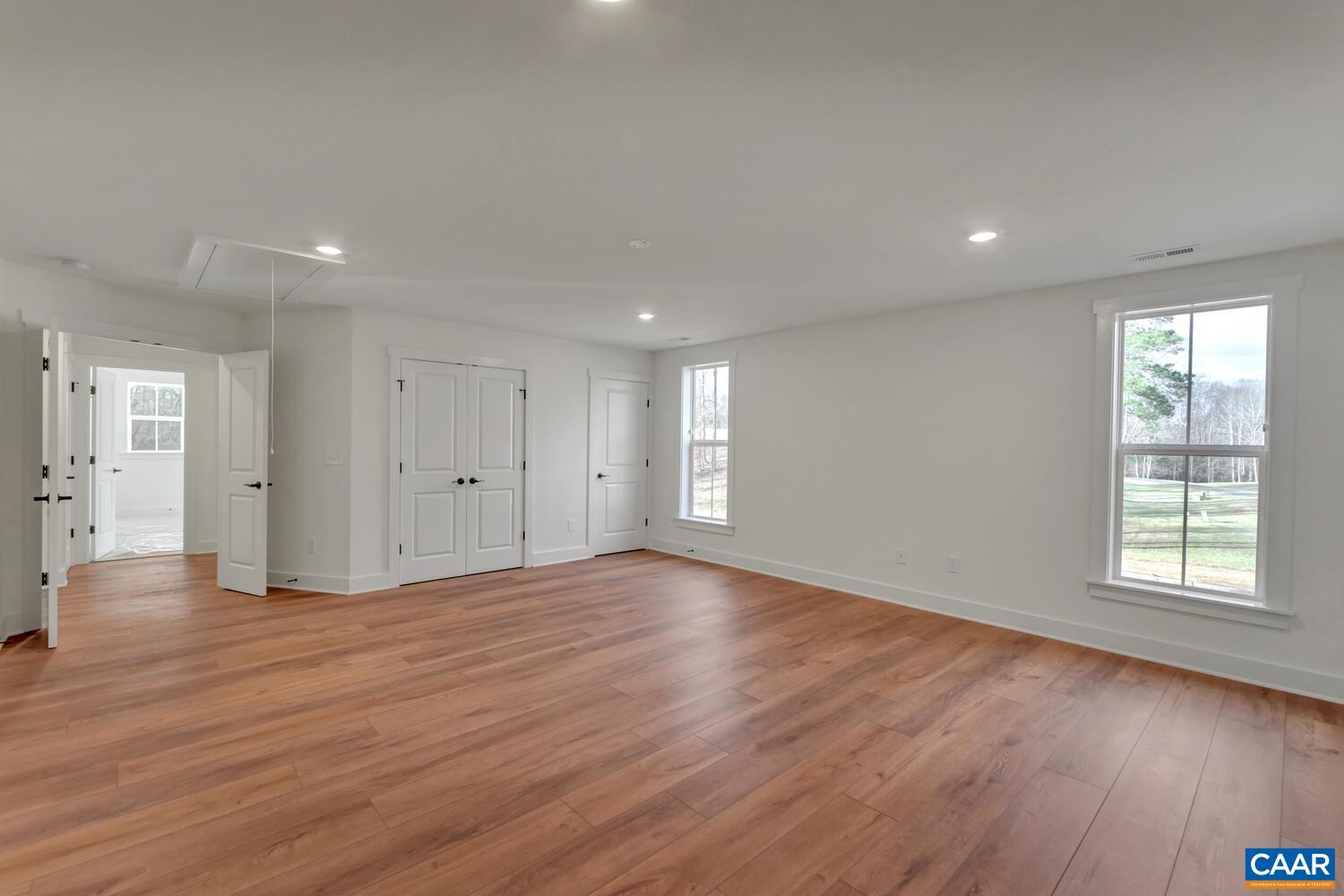2 Jarmans Gap Road, Unit LOT 2 JARMANS GAP Crozet, VA 22932 - Photo 44 of 48 a view of an empty room with wooden floor and a window