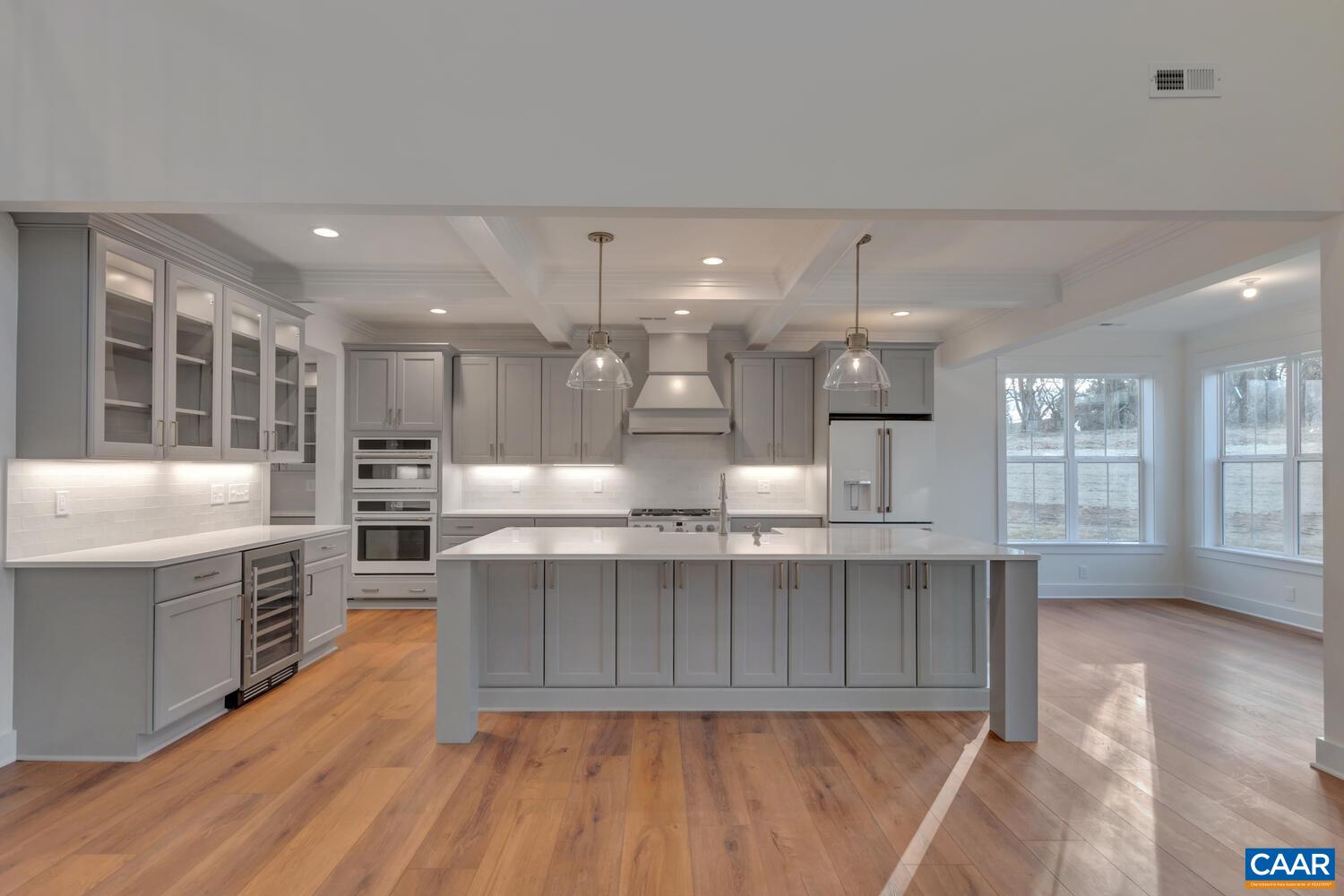 2 Jarmans Gap Road, Unit LOT 2 JARMANS GAP Crozet, VA 22932 - Photo 8 of 48 a large kitchen with stainless steel appliances a large counter top a stove a chimney a sink and cabinets