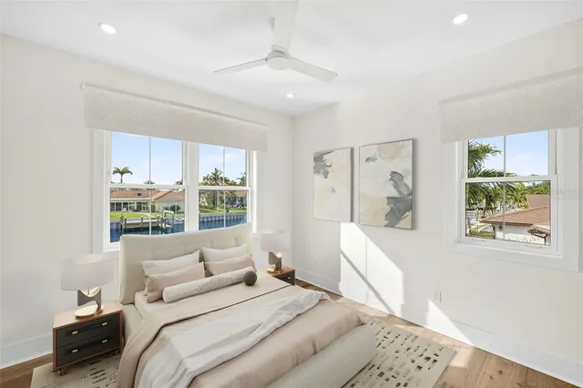 a kitchen with granite countertop white cabinets and a sink
