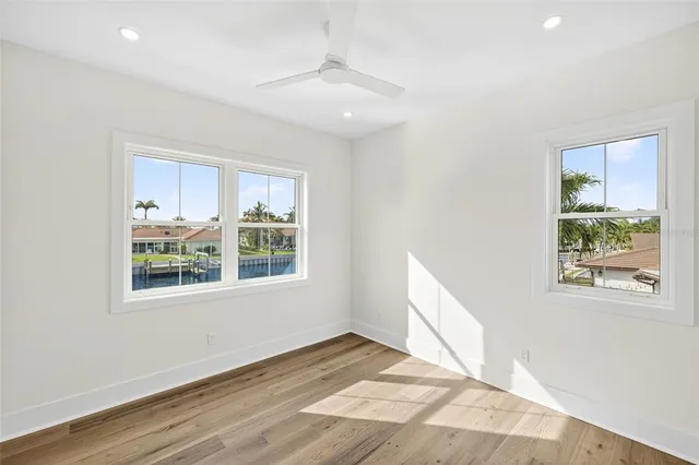 a view of swimming pool with outdoor seating and yard in back