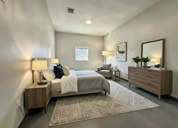 a bed room with bed and window