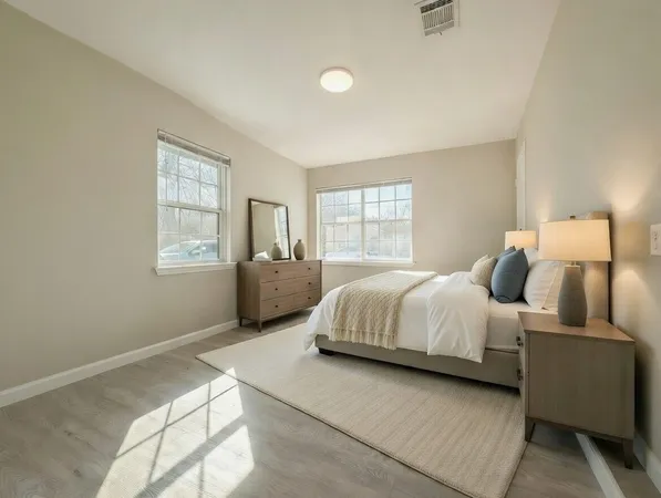 a bedroom with bed and window