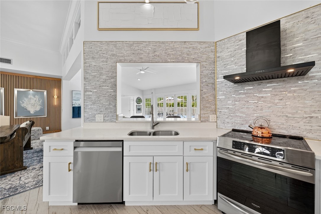 13570 Harbour Ridge Drive Fort Myers, FL 33908 - Photo 17 of 50 a kitchen with a stove and a sink