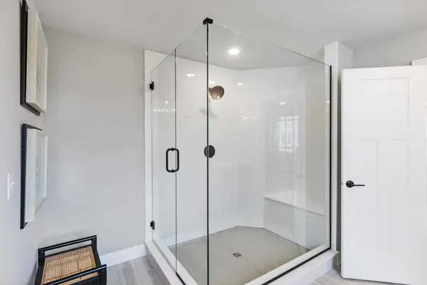 a bathroom with a shower and a sink
