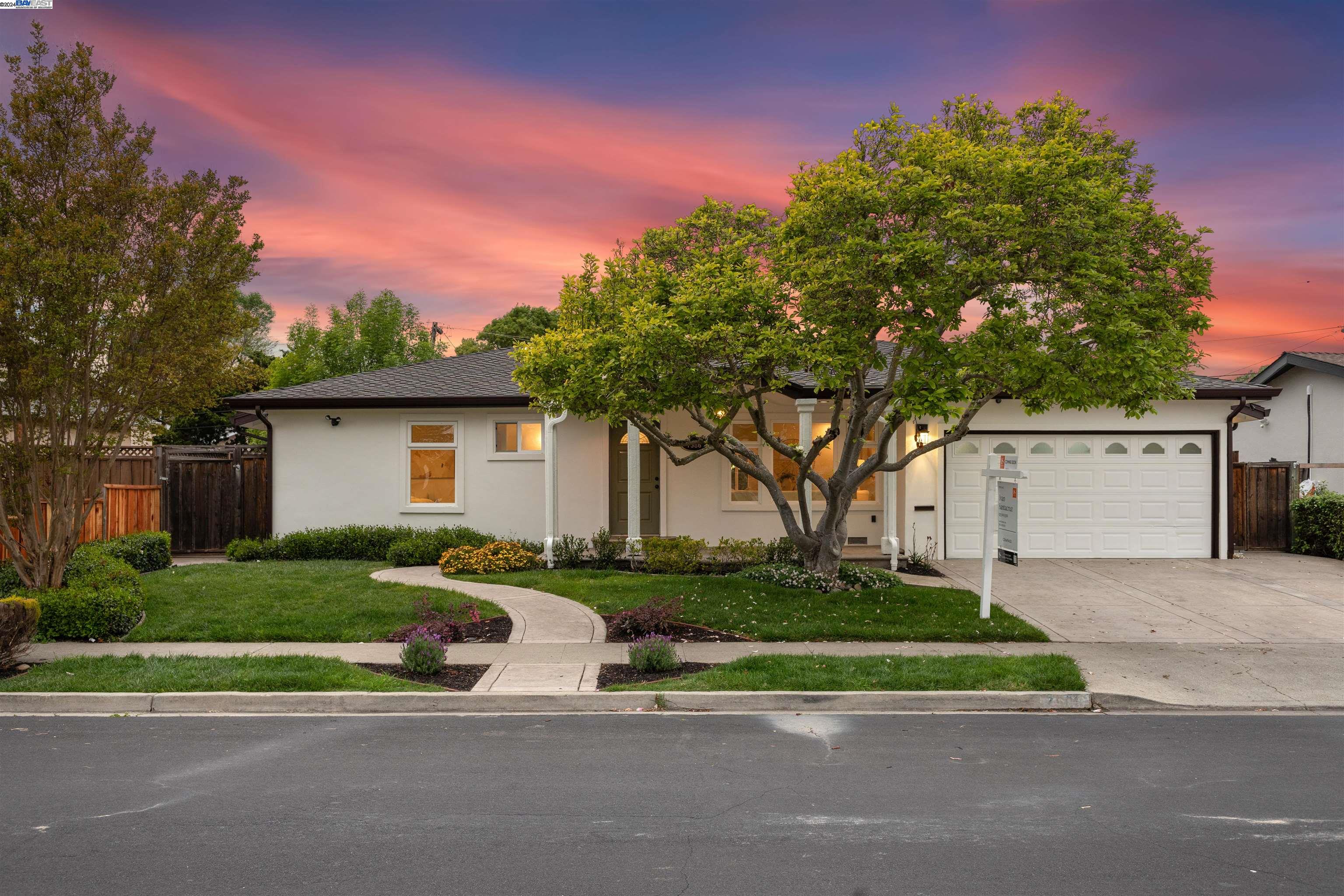 front view of a house with a yard