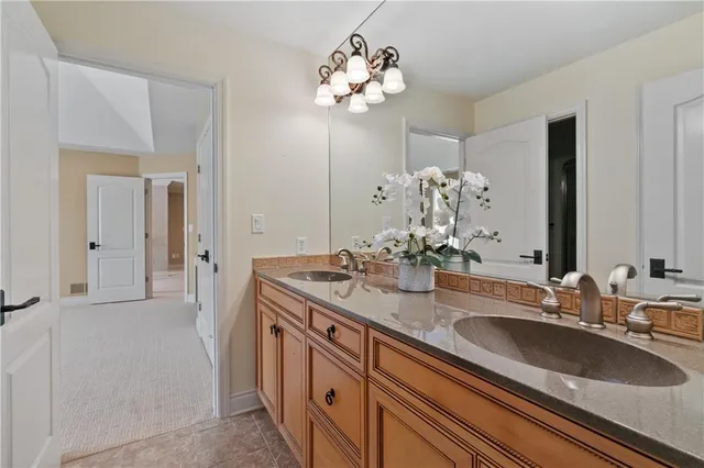 a bathroom with a sink double vanity and a mirror