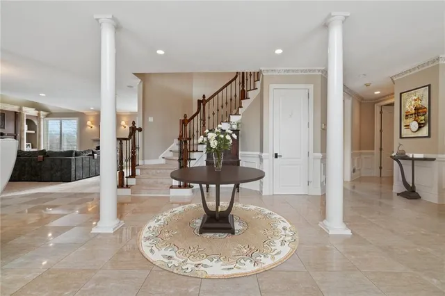 a view of a living room and entryway