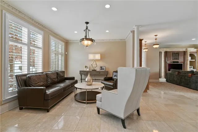 a living room with furniture and a large window