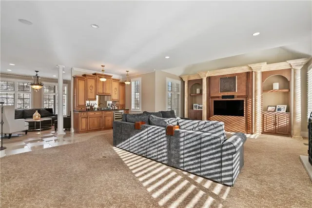 a bedroom with furniture and a fireplace
