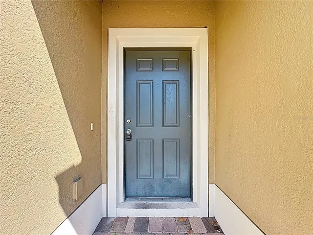 a view of front door with wooden floor
