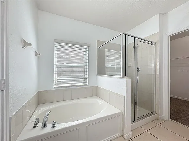 a white bath tub sitting next to a window