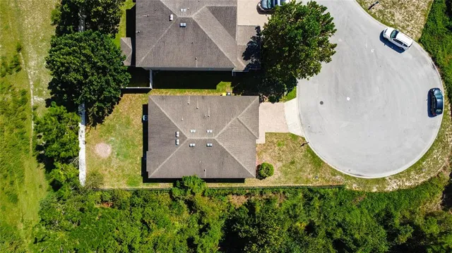 an aerial view of a house with garden space sitting space and swimming pool
