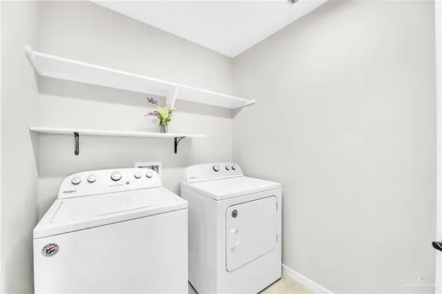 a utility room with dryer and washer