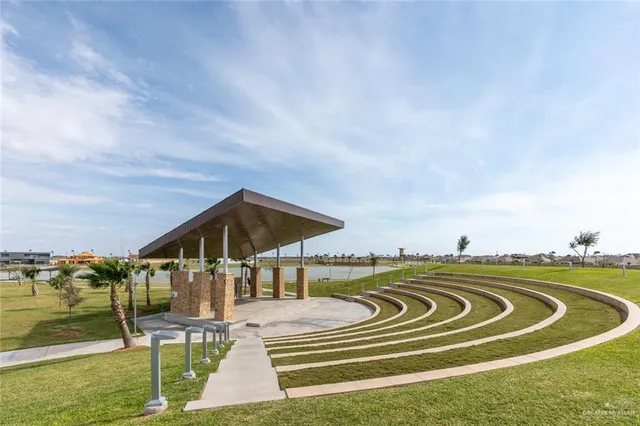 a view of swimming pool with seating area and furniture