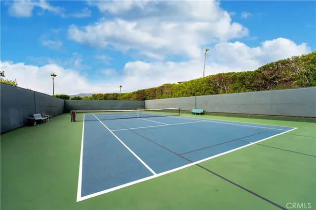 a view of an outdoor space and tennis court