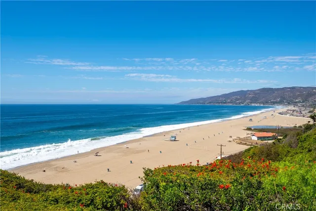 an aerial view of beach and ocean