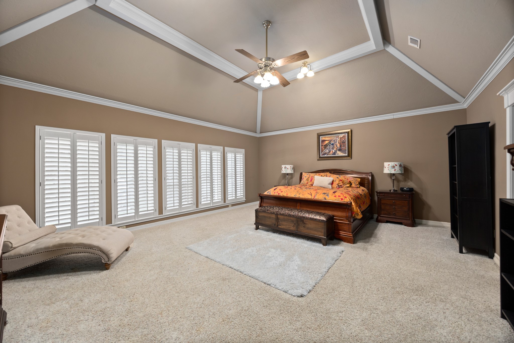8807 Chelmsford Lane Spring, TX 77379 - Photo 24 of 50 The first floor master bedroom is absolutely massive at nearly 22' x 19'. The new windows overlooking the back yard are covered by plantation shutters.