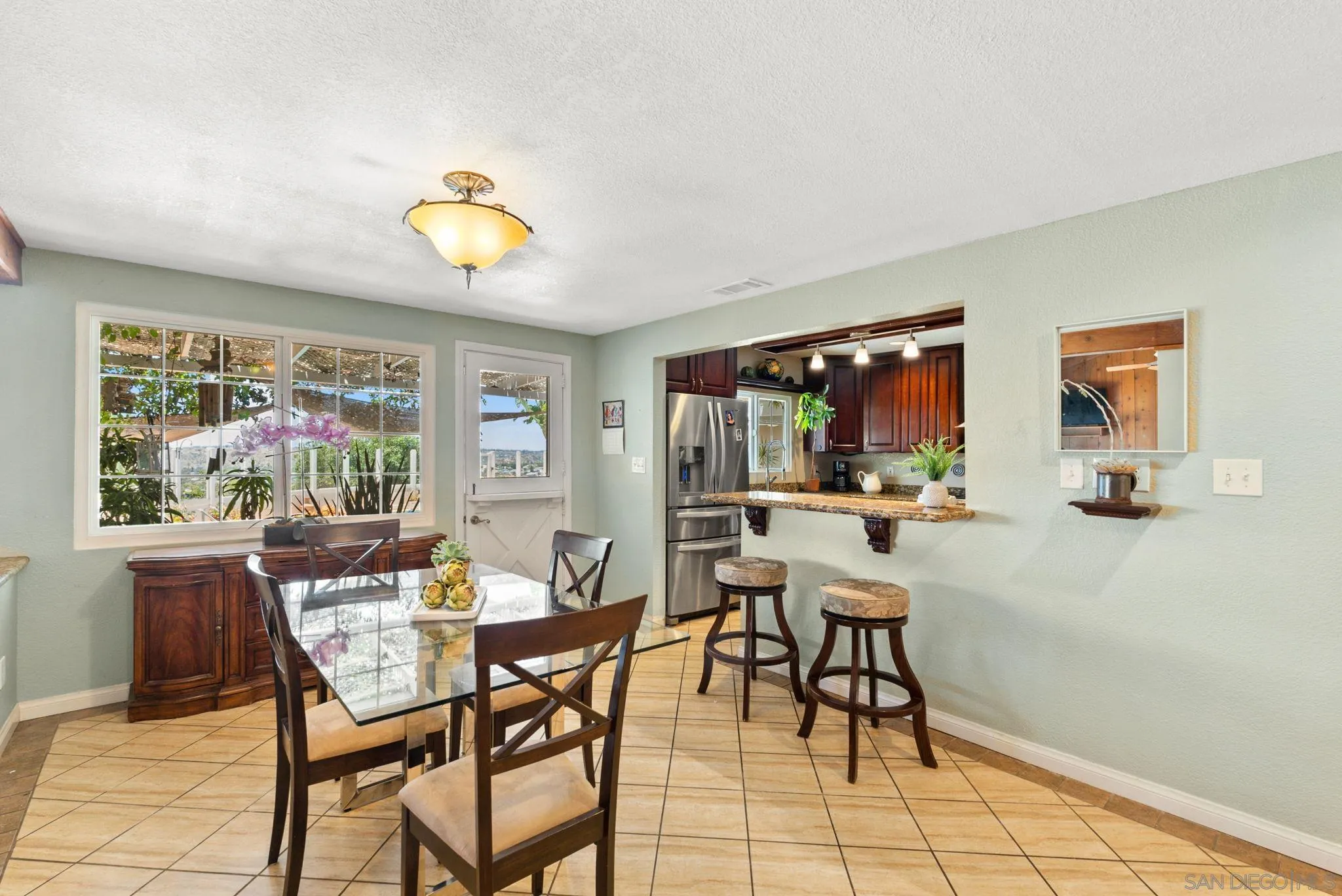 5492 Redding Road San Diego, CA 92115 - Photo 11 of 74 a view of a dining room with furniture window and outside view