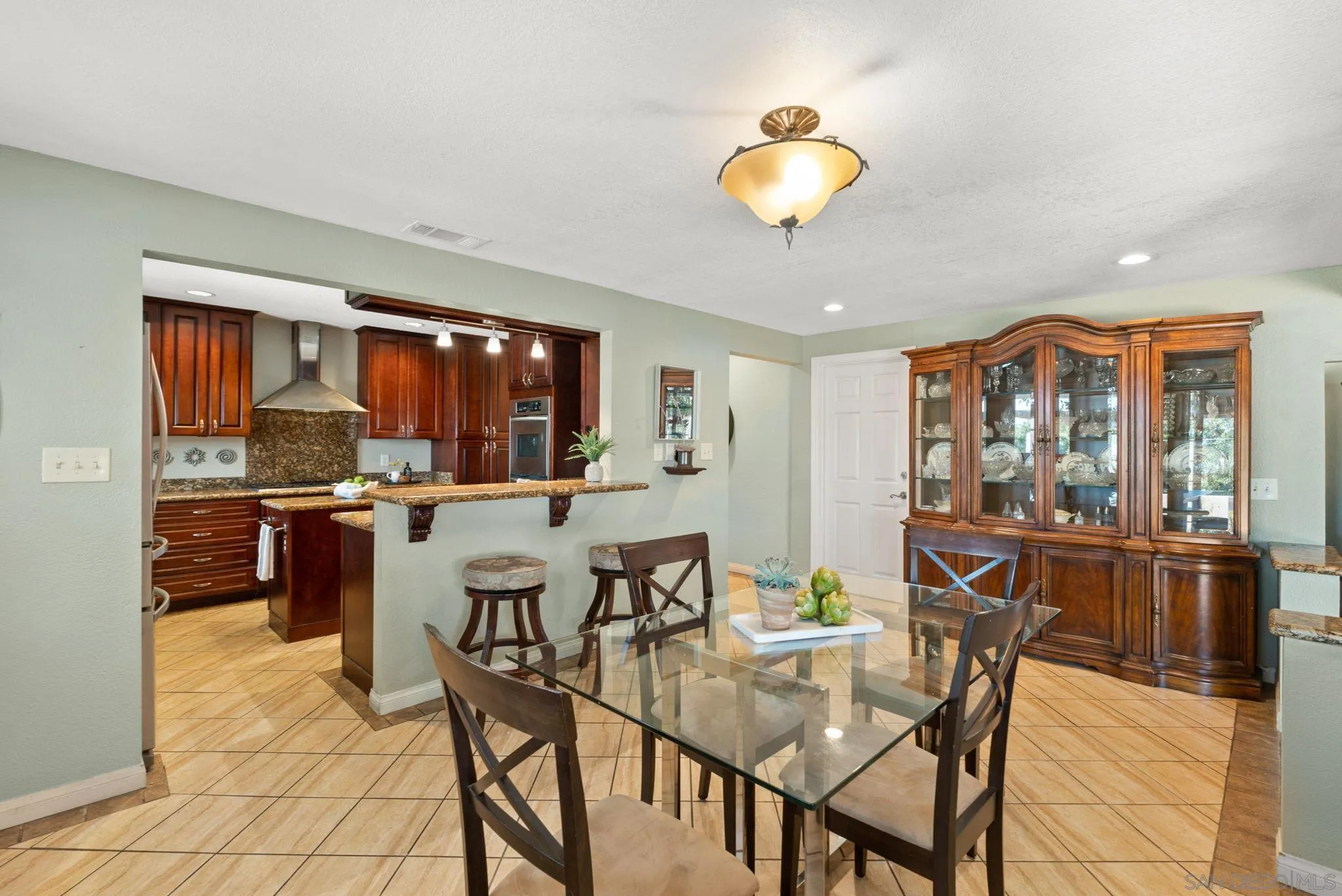 5492 Redding Road San Diego, CA 92115 - Photo 12 of 74 a view of a dining room with furniture and chandelier