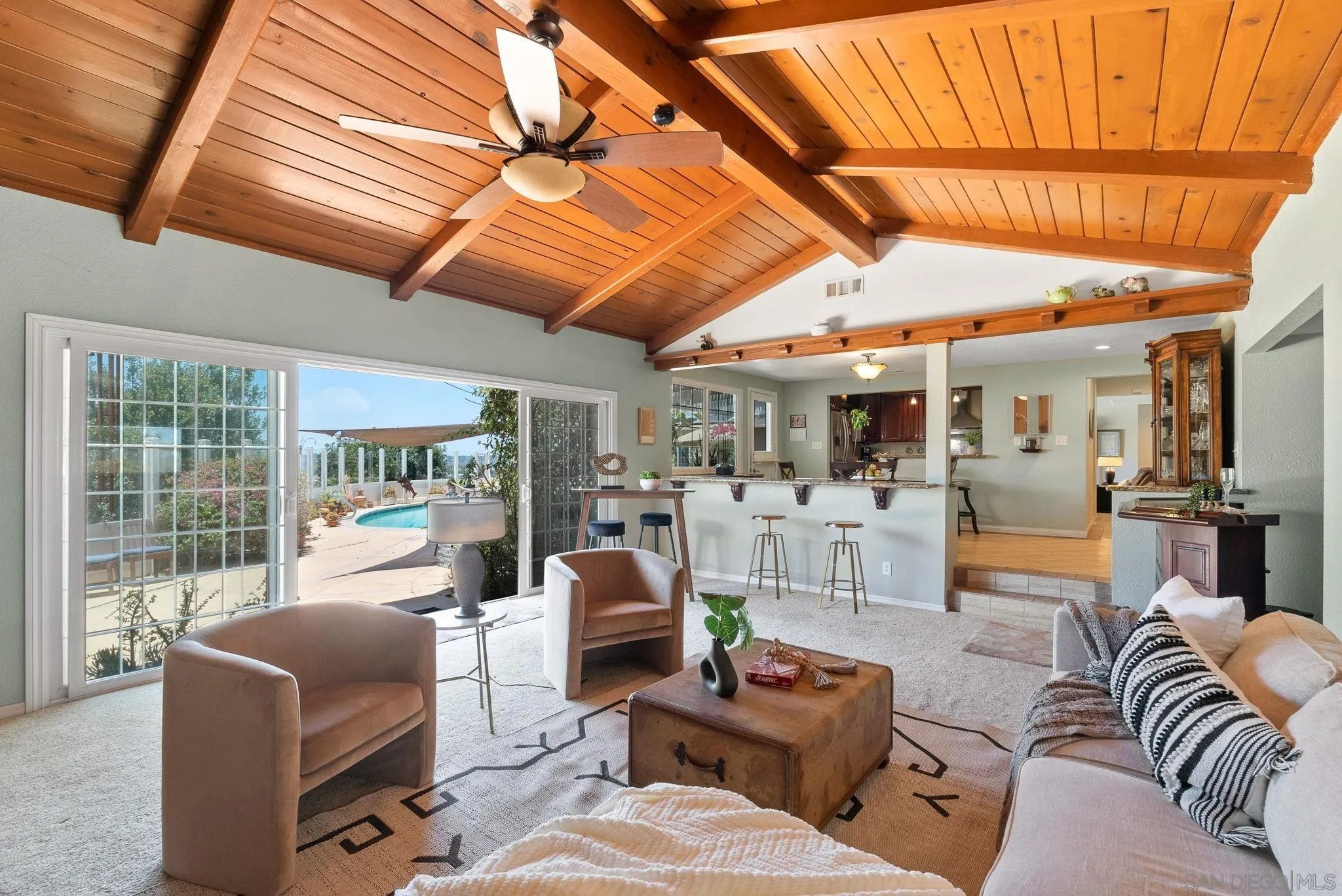 5492 Redding Road San Diego, CA 92115 - Photo 20 of 74 a living room with furniture and a floor to ceiling window