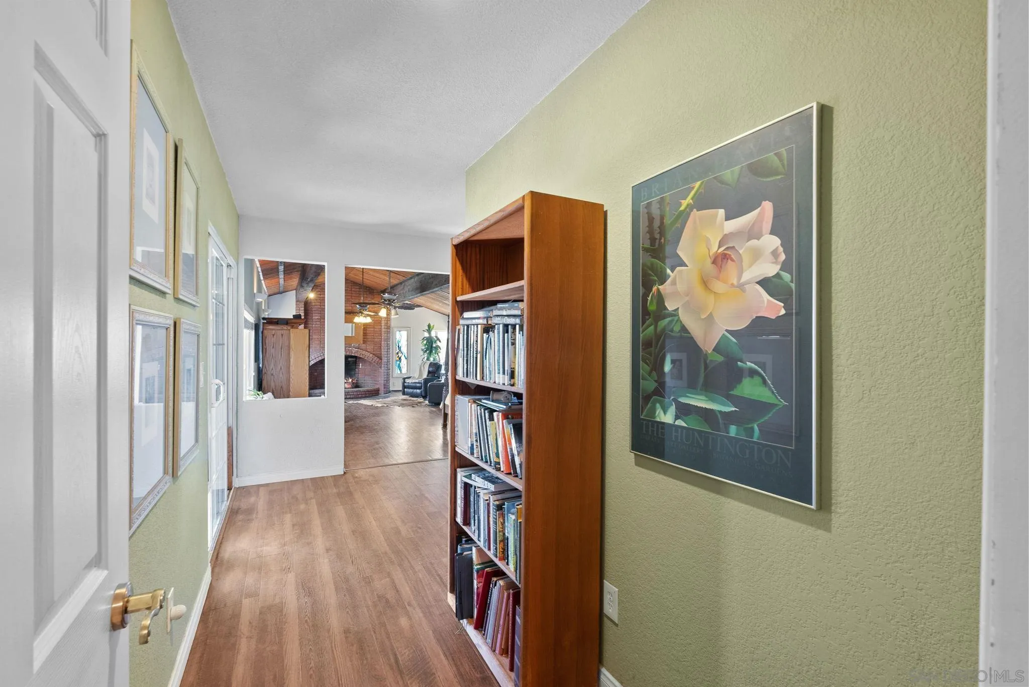 5492 Redding Road San Diego, CA 92115 - Photo 25 of 74 a view of a hallway with wooden floor and furniture