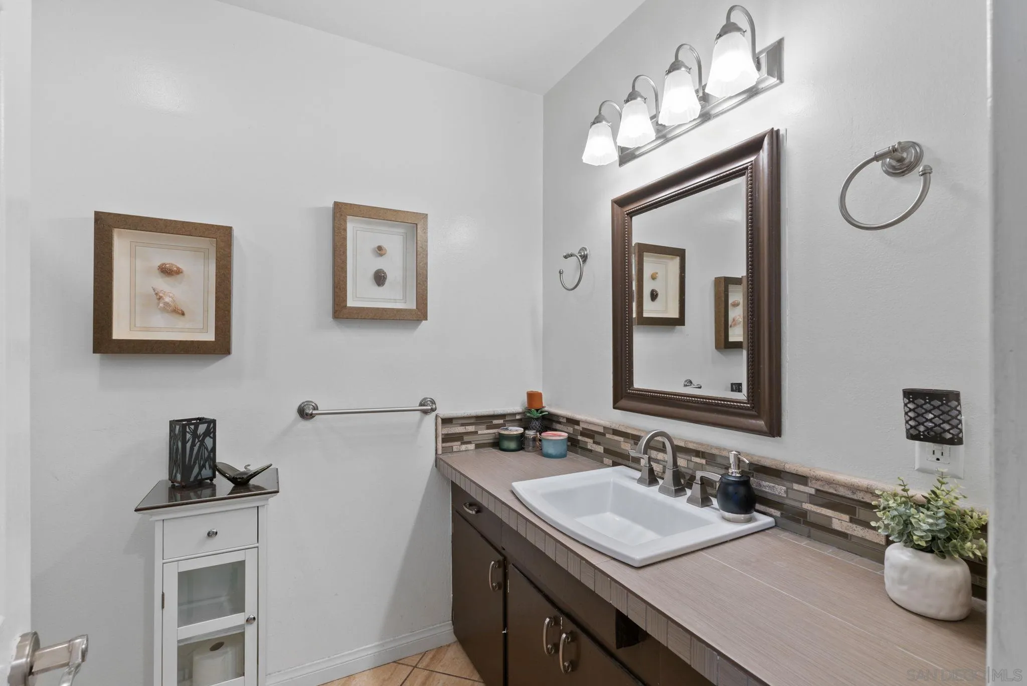5492 Redding Road San Diego, CA 92115 - Photo 32 of 74 a bathroom with a sink vanity and mirror