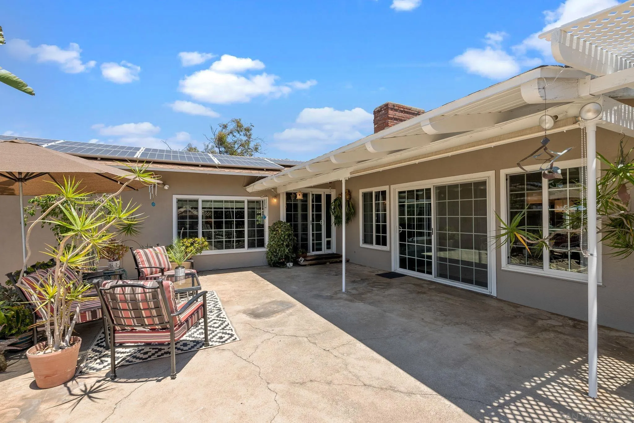 5492 Redding Road San Diego, CA 92115 - Photo 36 of 74 a view of a house with backyard and sitting area