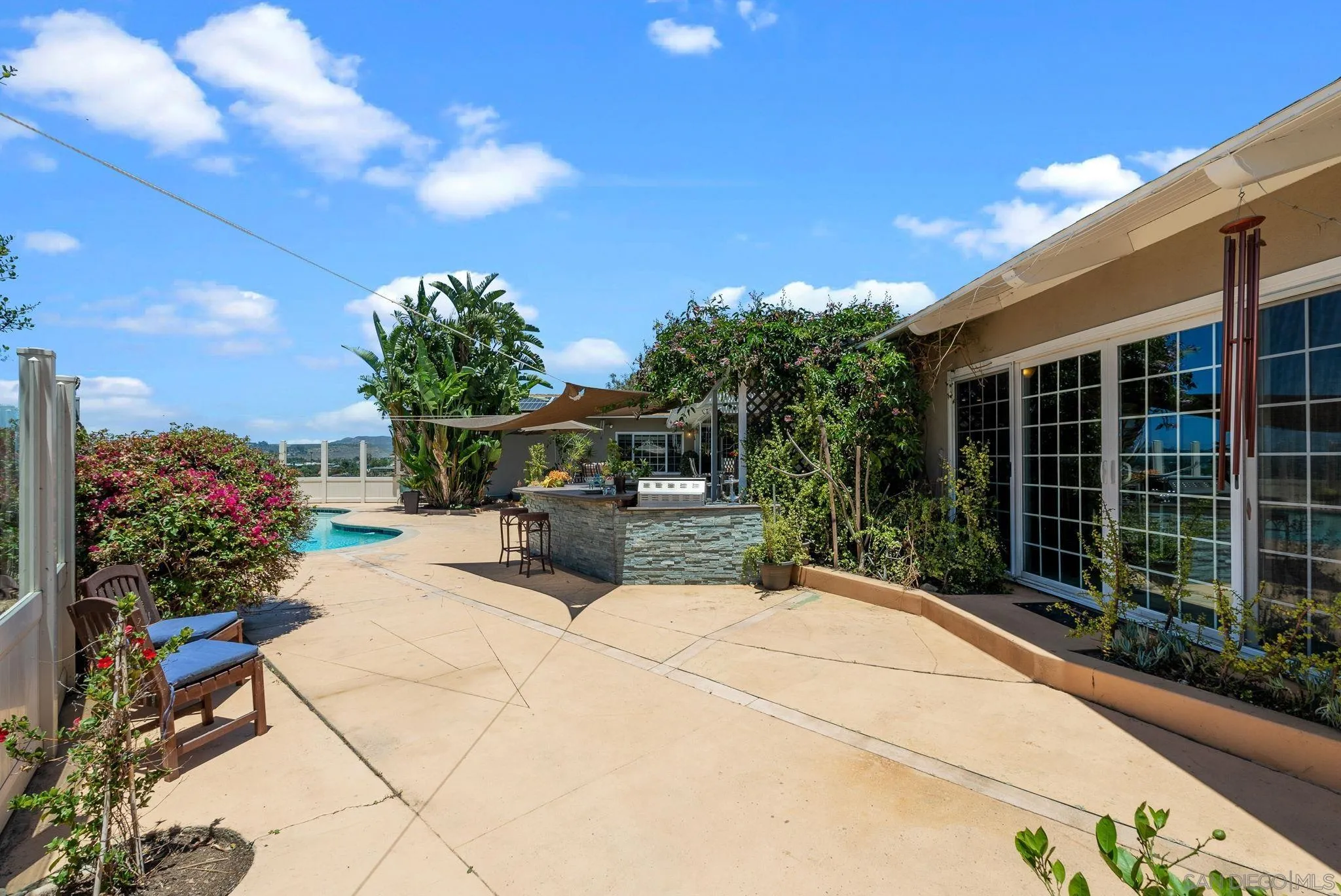 5492 Redding Road San Diego, CA 92115 - Photo 38 of 74 a view of a chair and tables in the garden