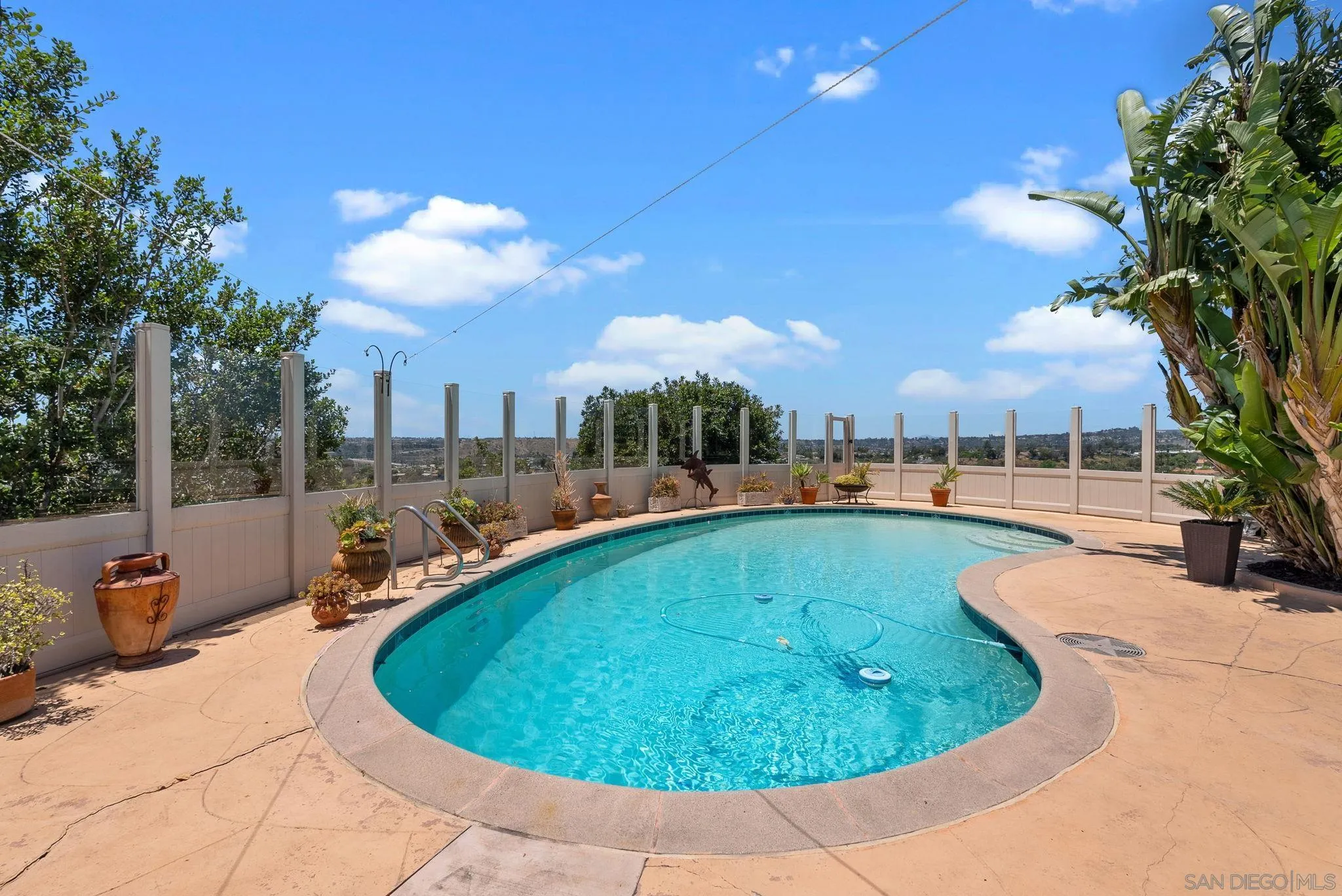 5492 Redding Road San Diego, CA 92115 - Photo 40 of 74 a view of a swimming pool with a patio