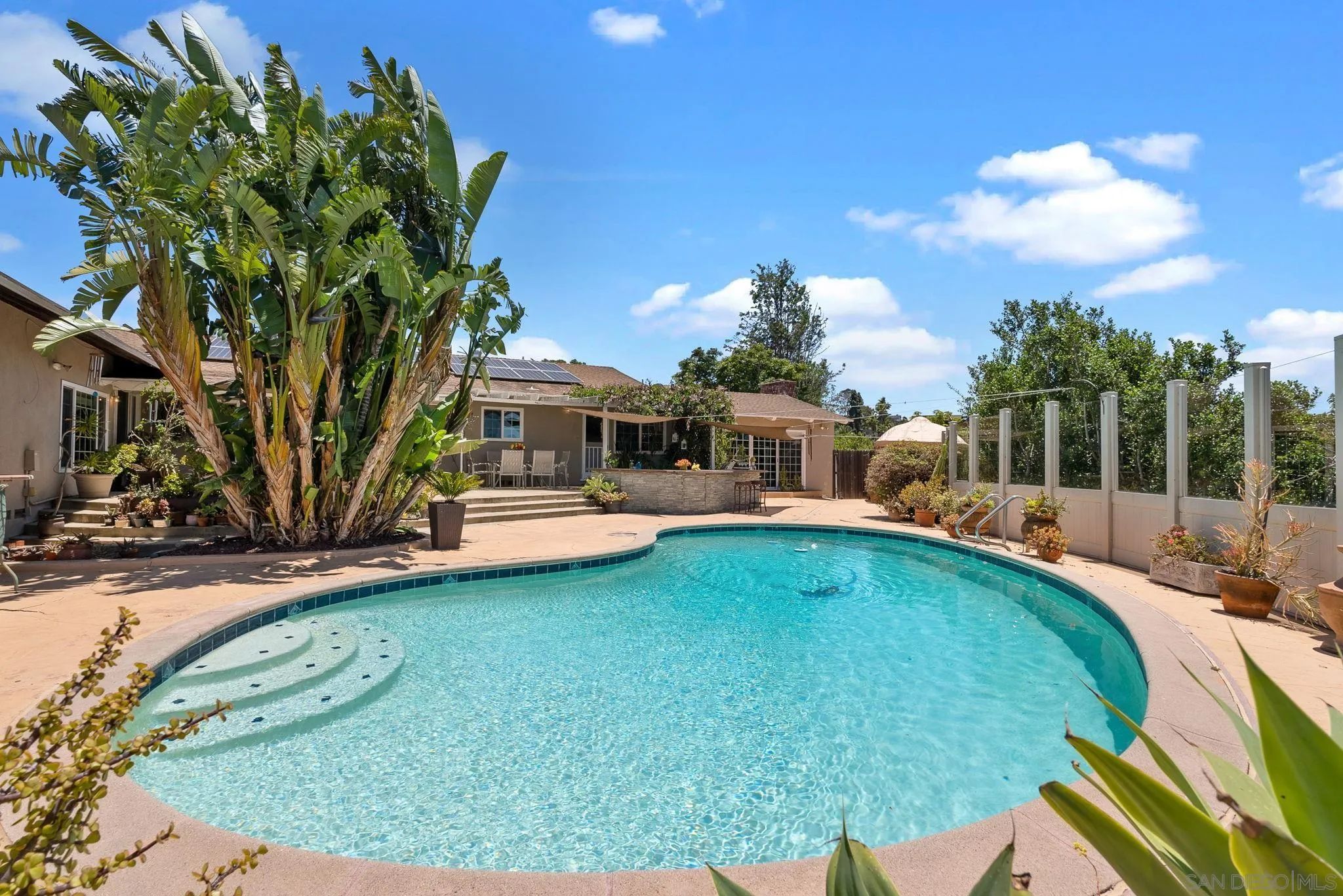 5492 Redding Road San Diego, CA 92115 - Photo 45 of 74 a view of a house with backyard swimming pool and sitting area