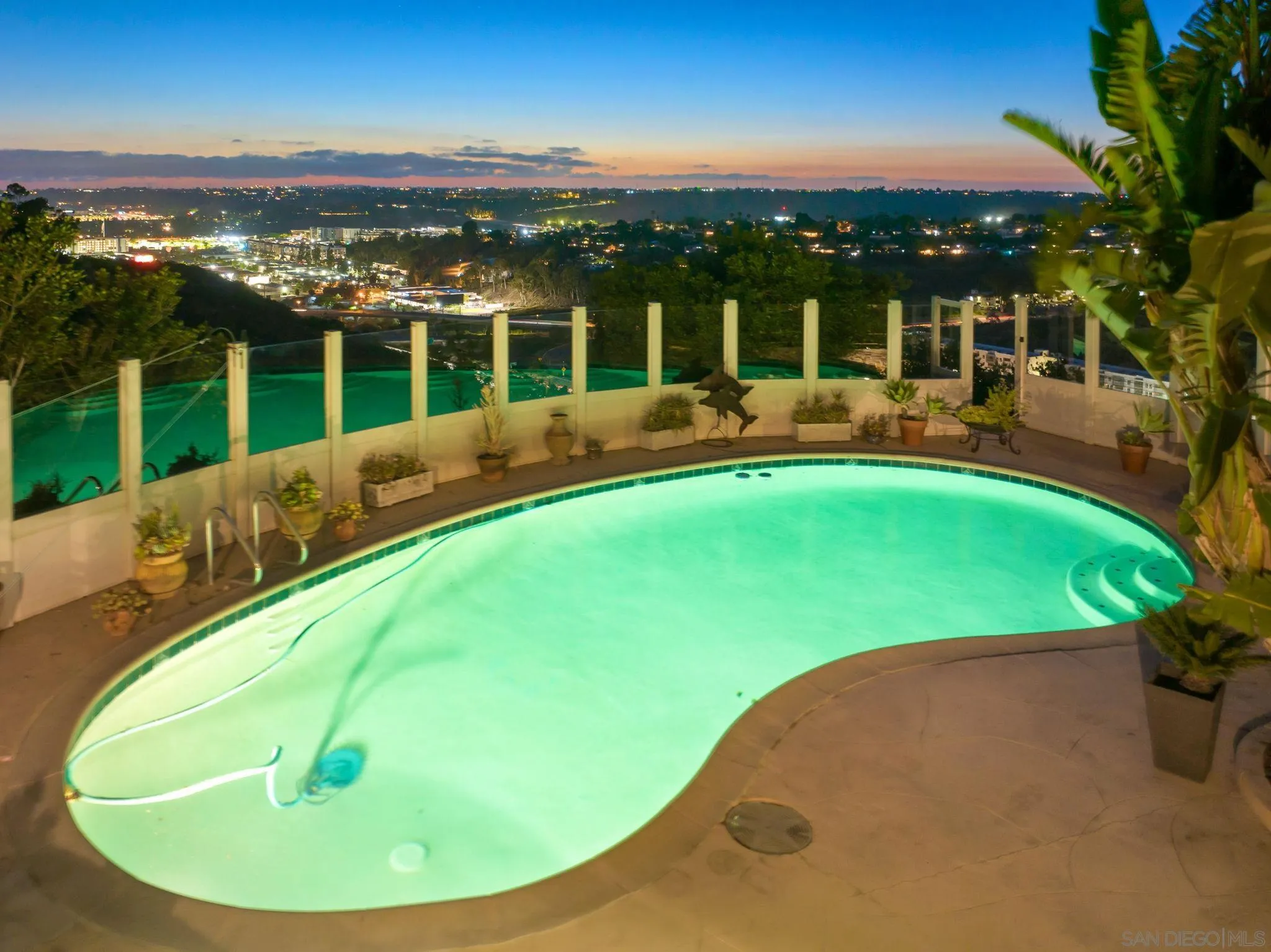 5492 Redding Road San Diego, CA 92115 - Photo 51 of 74 a view of a swimming pool with a lawn chairs