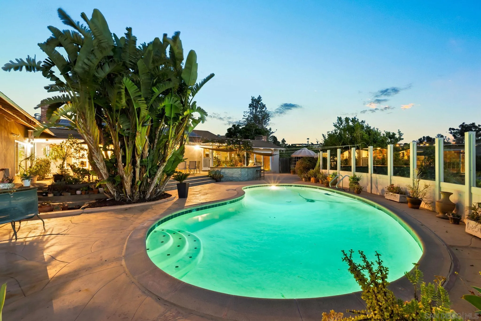 5492 Redding Road San Diego, CA 92115 - Photo 53 of 74 a view of a swimming pool with a yard and sitting area