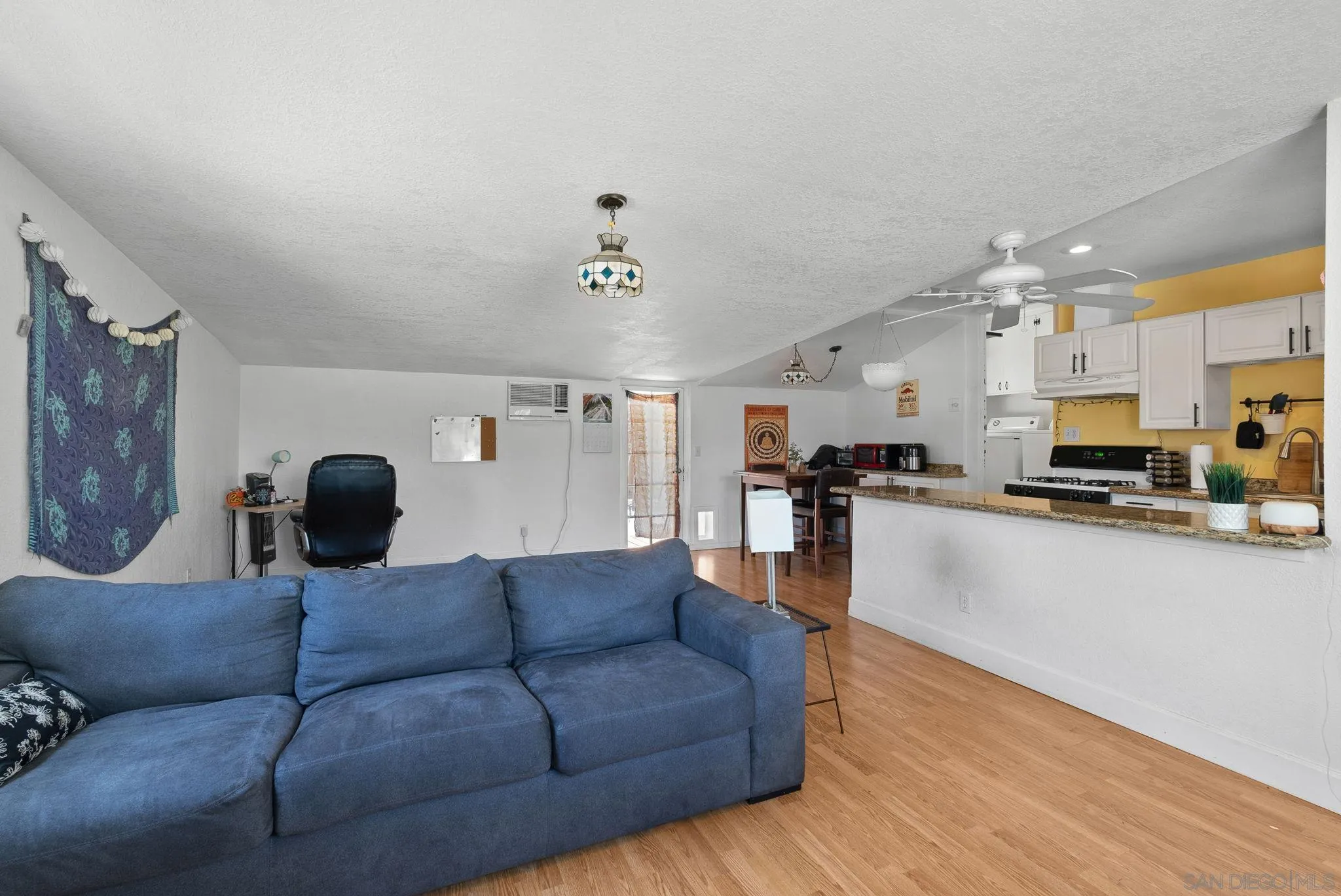 5492 Redding Road San Diego, CA 92115 - Photo 63 of 74 a living room with furniture and kitchen view