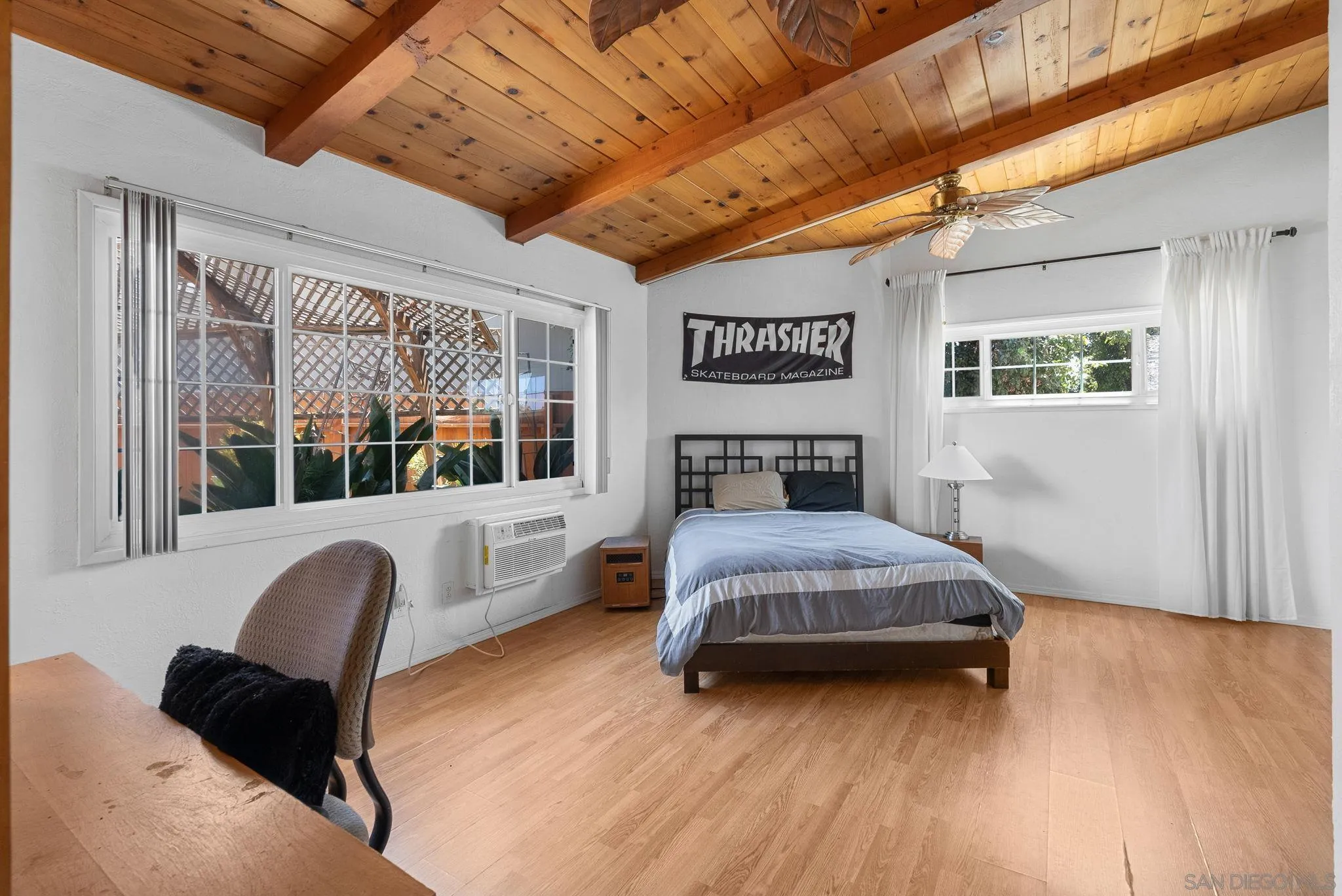 5492 Redding Road San Diego, CA 92115 - Photo 66 of 74 a bedroom with a bed wooden floor and window