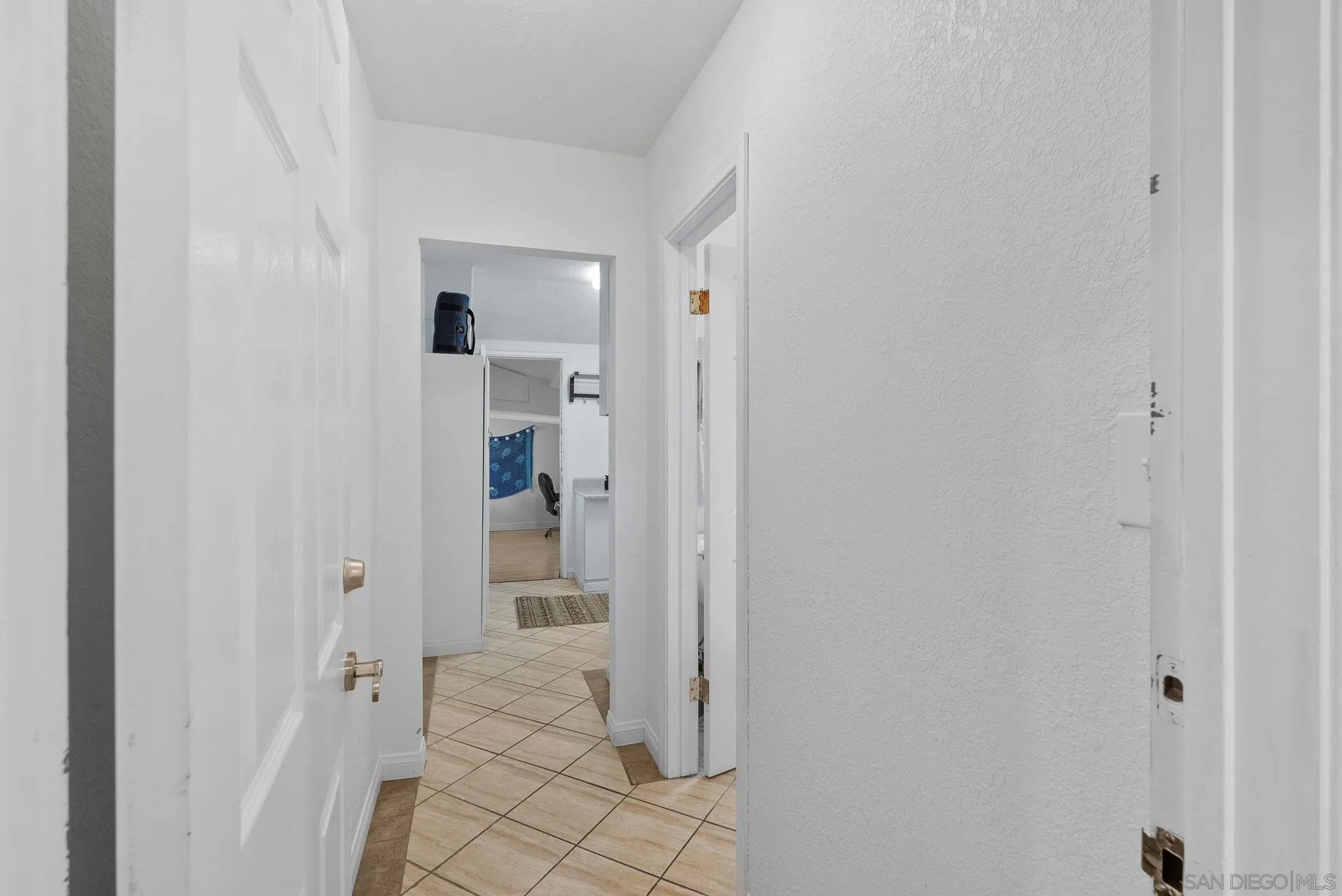 5492 Redding Road San Diego, CA 92115 - Photo 68 of 74 a view of a hallway with wooden floor and entryway