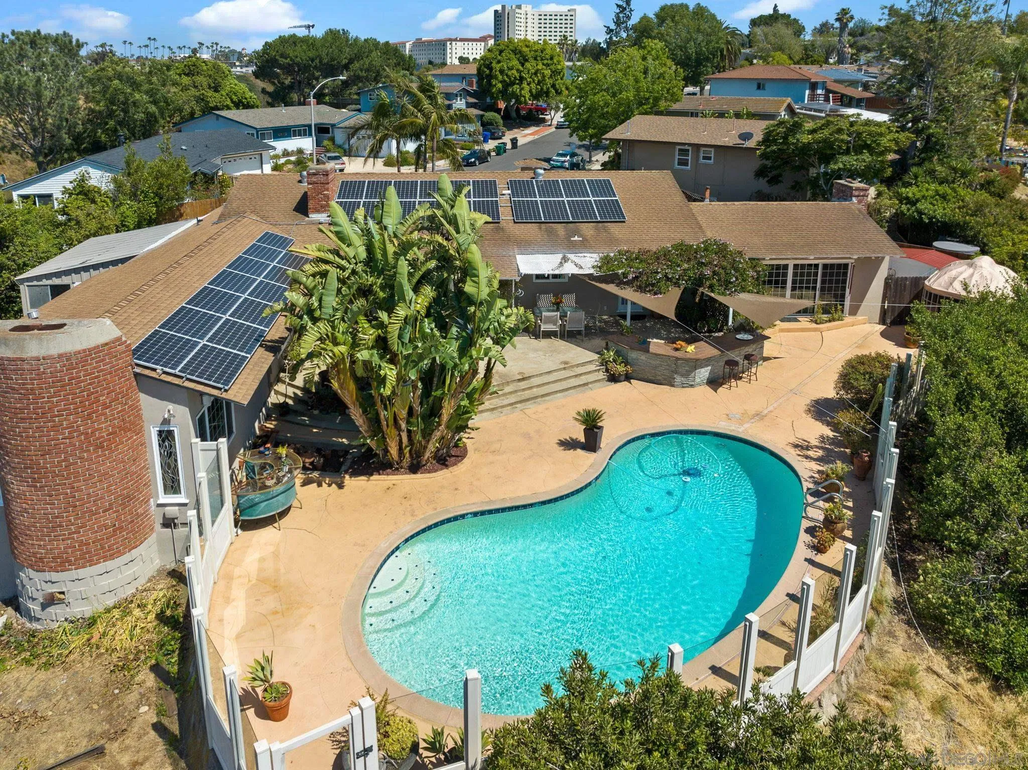 5492 Redding Road San Diego, CA 92115 - Photo 72 of 74 an aerial view of a swimming pool with a yard and outdoor seating