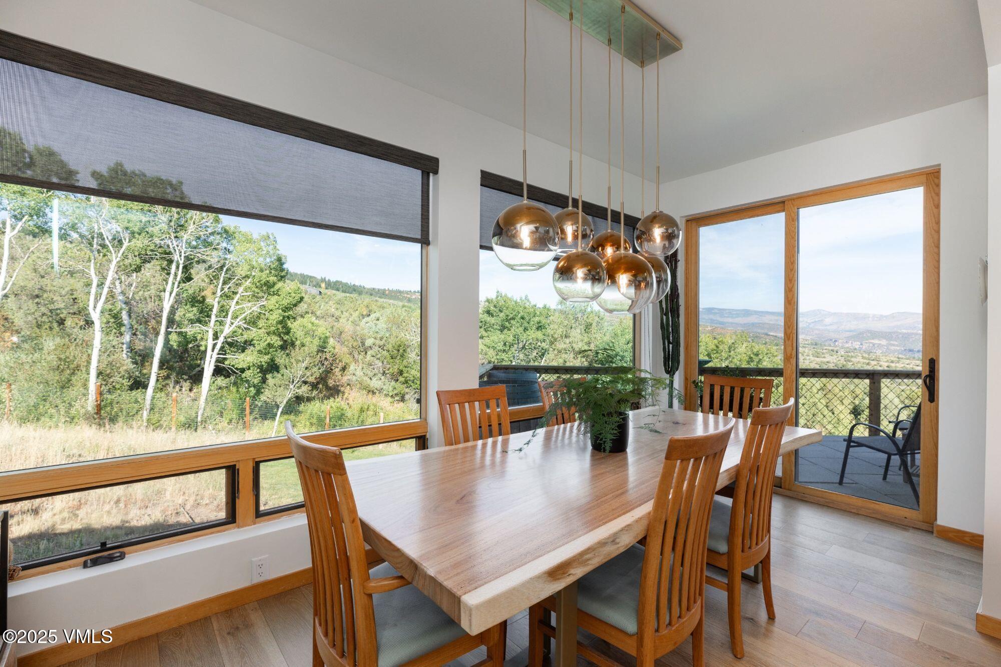 948 Wolcott Springs Road Wolcott, CO 81655 - Photo 8 of 49 a view of a dining room with furniture window and outside view