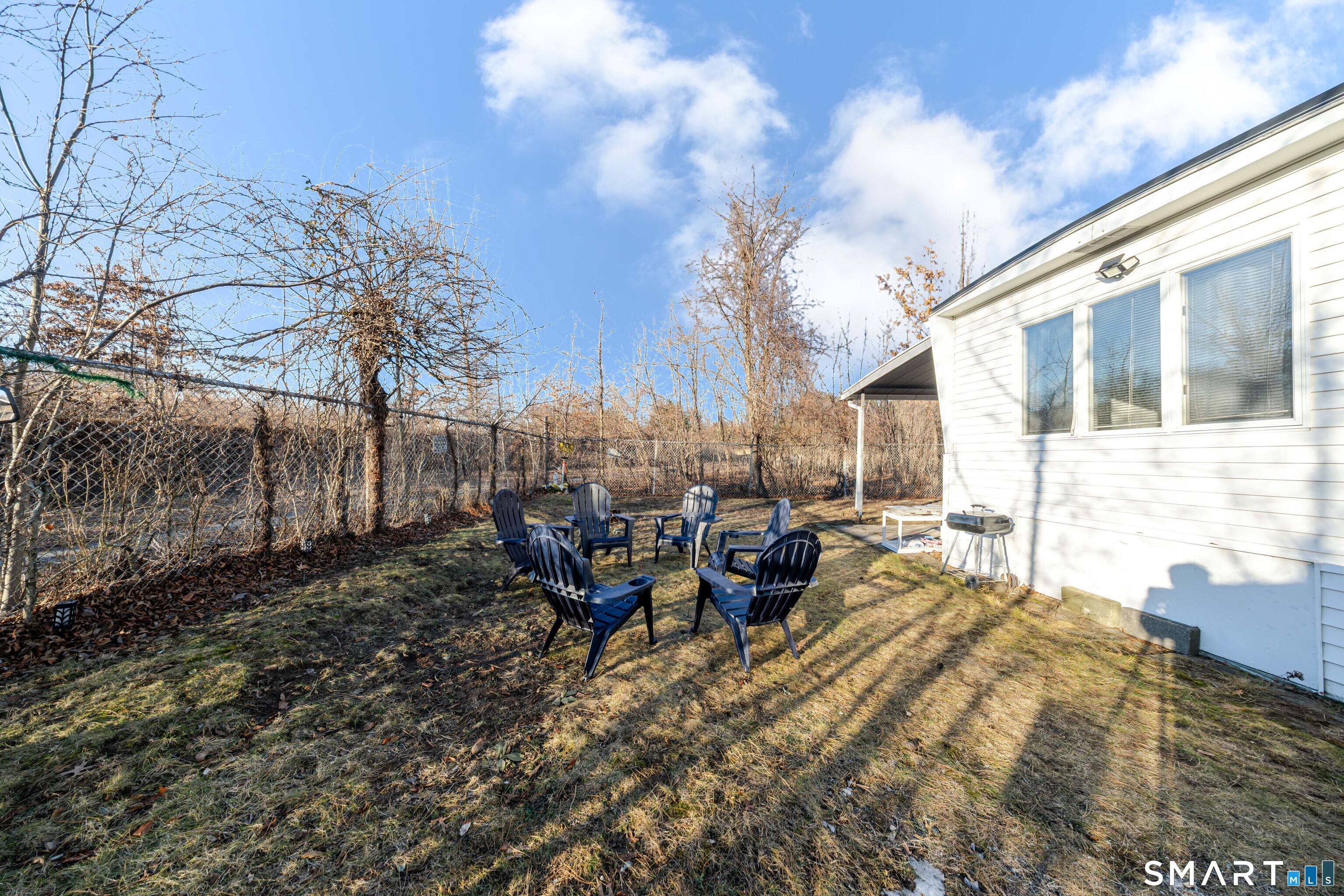 93 Shawnee Road East Hartford, CT 06118 - Photo 36 of 37 a backyard of a house with table and chairs