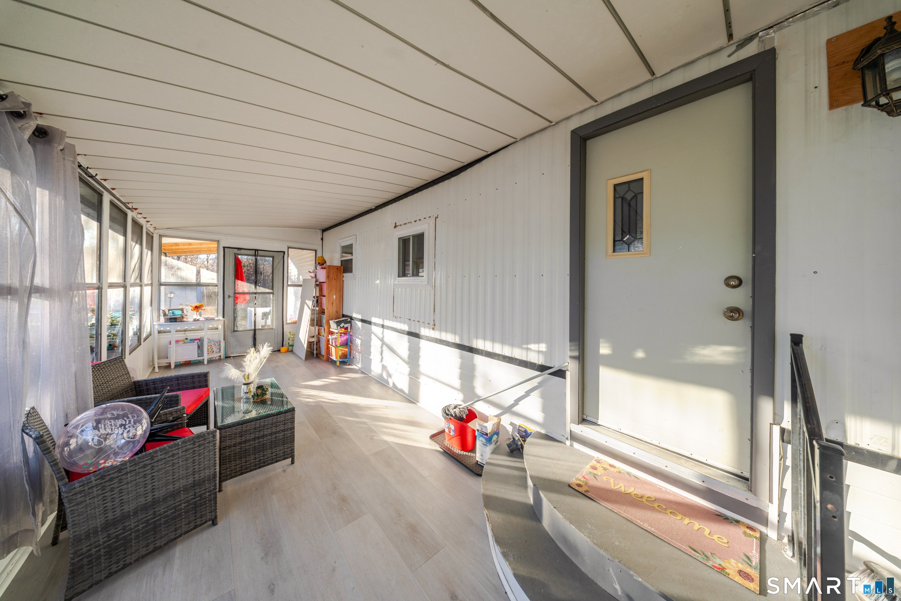 93 Shawnee Road East Hartford, CT 06118 - Photo 6 of 37 a living room with couch and a table