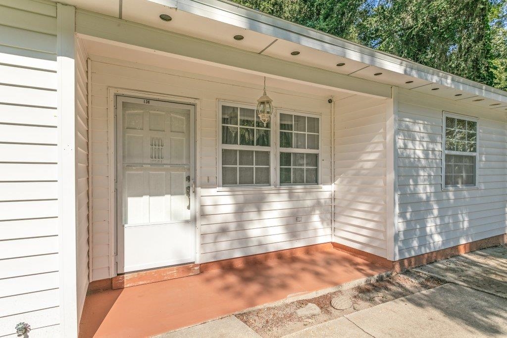 138 Hawthorne Road St. Augustine, FL 32086 - Photo 5 of 46 a view of a porch with a bench