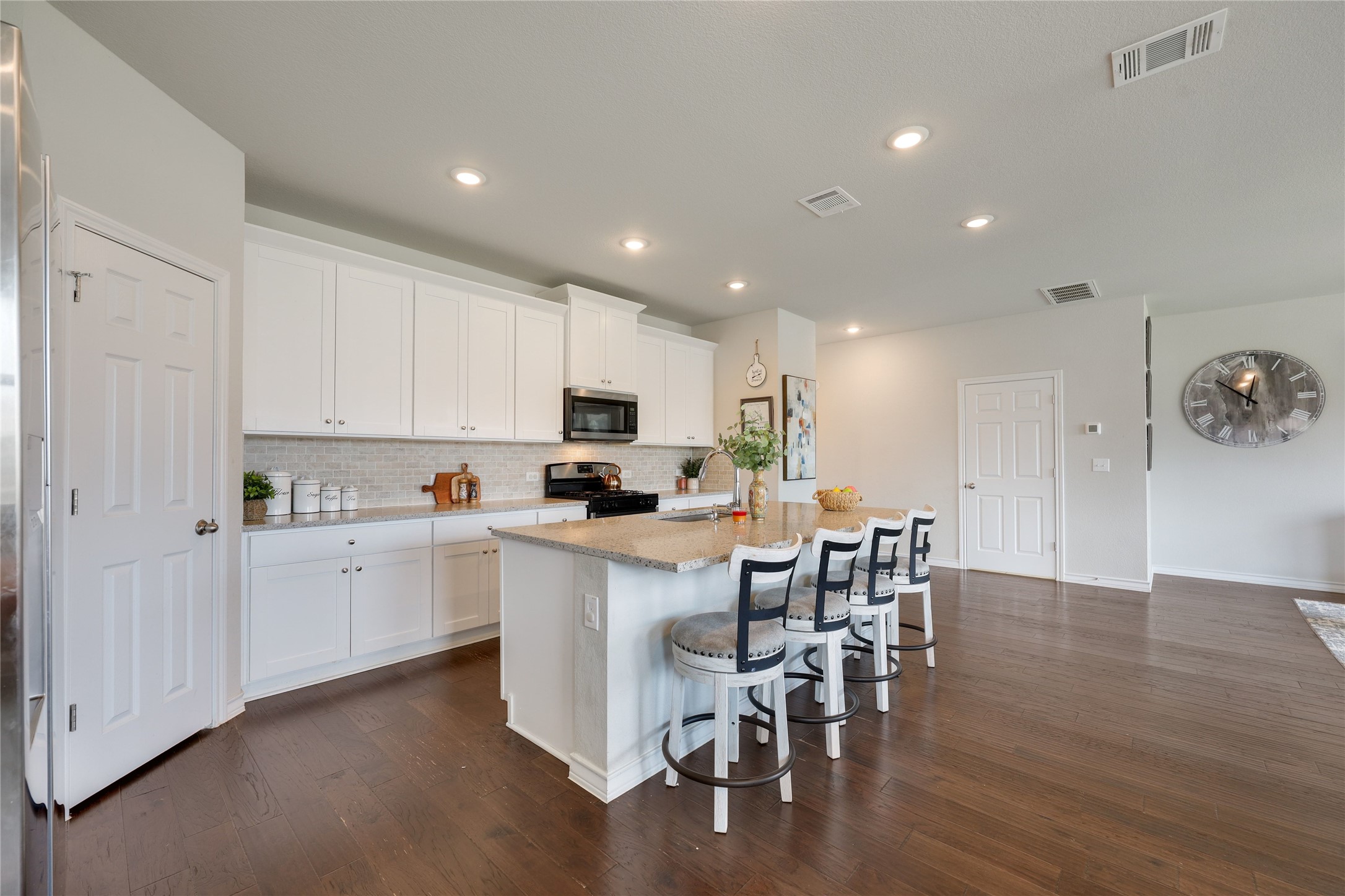 7404 Albany Drive Austin, TX 78754 - Photo 13 of 40 The kitchen is perfectly positioned to overlook the living room and dining area making it easy to stay connected.