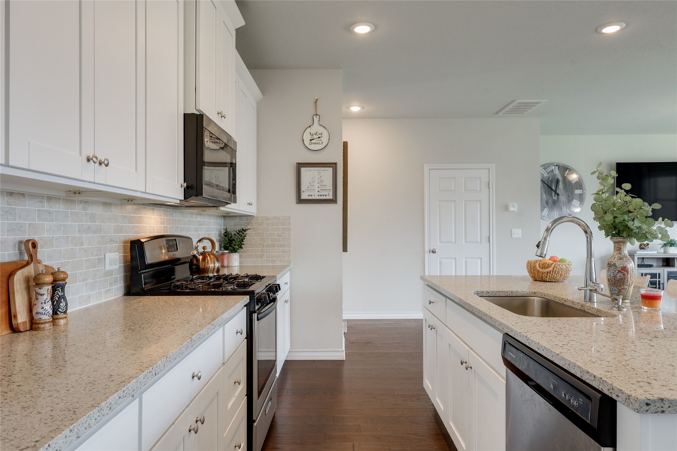 7404 Albany Drive Austin, TX 78754 - Photo 14 of 40 Durable granite countertops pair well with tastefully selected tile backsplash.