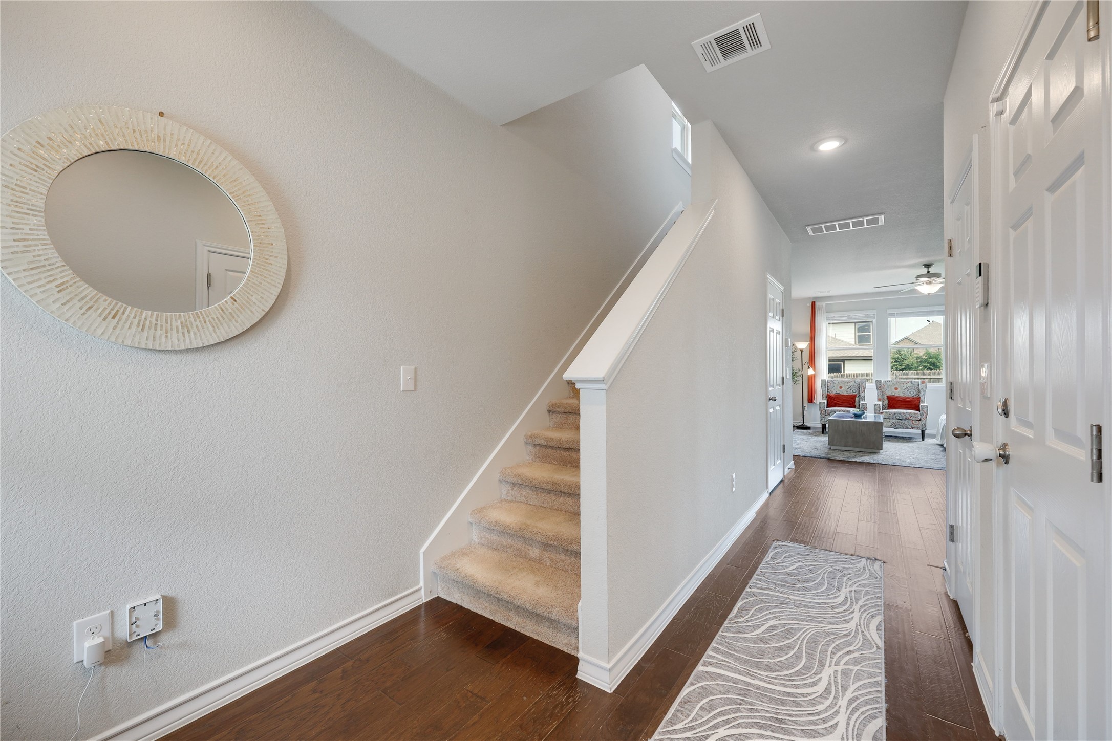 7404 Albany Drive Austin, TX 78754 - Photo 17 of 40 The foyer flows past the stairway to the second floor bedrooms into the main living area.